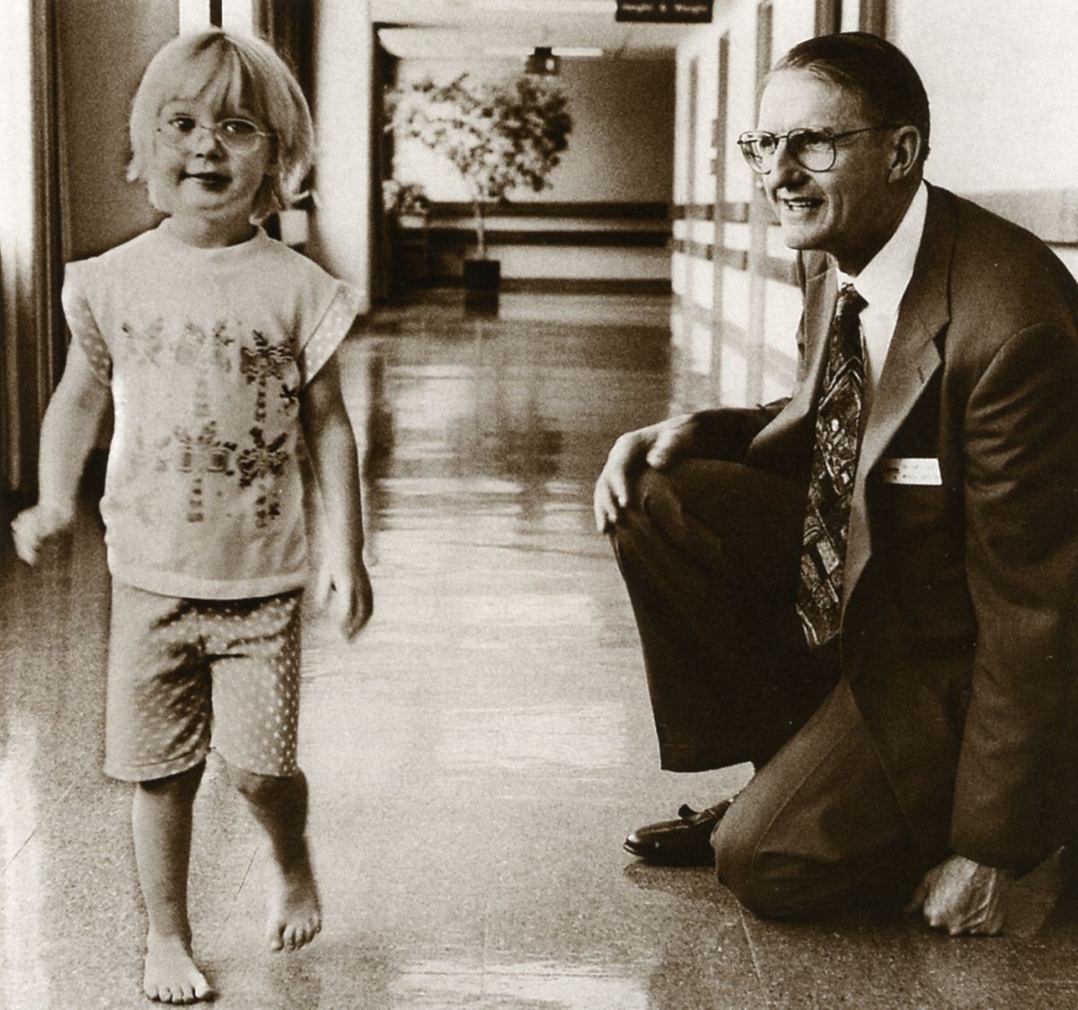 Jim Gage, MD, assesses a young patient's gait. 
