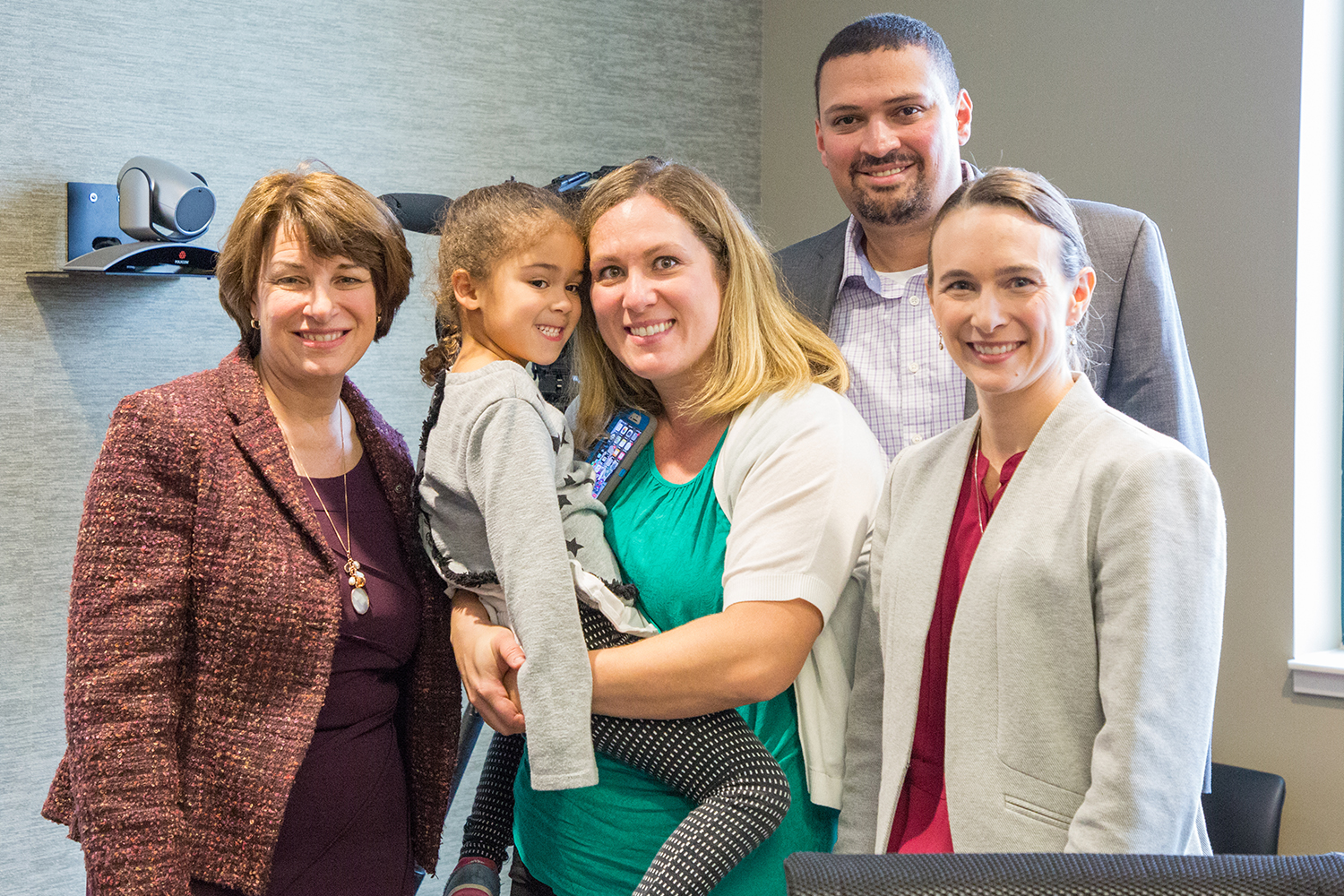 Senator Klobuchar poses with Dr. Angela Sinner and the parents of Sophia Ayouche