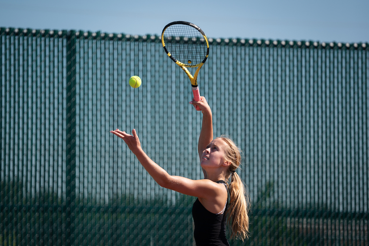Delaney Lundquist warms up for her tennis lesson. 