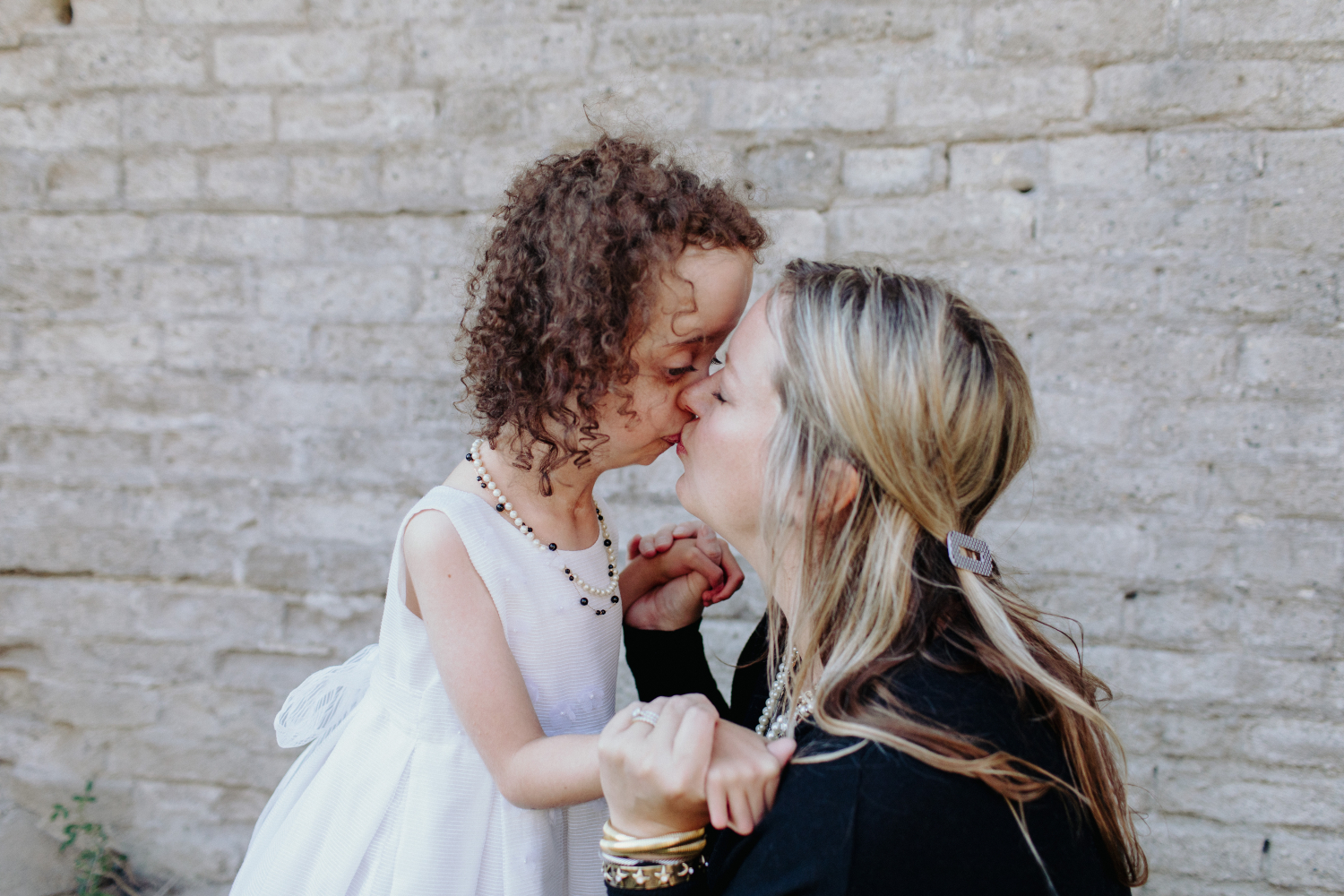 Leah Berkland kisses her daughter Peyton