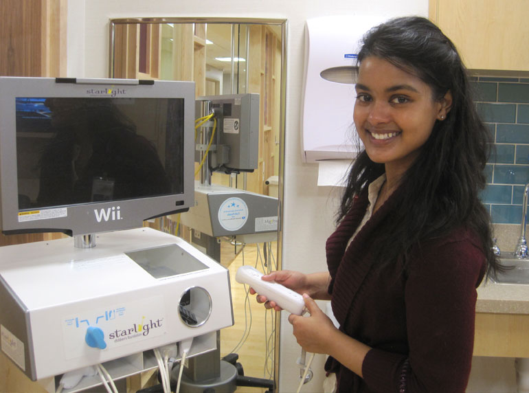 Kalpana Parsons plays video games with Gillette patients.