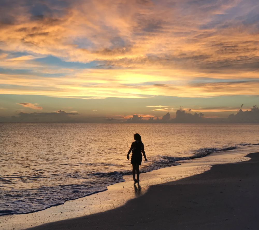 Katie, walking on the beach. - Photo by Edwina Allee