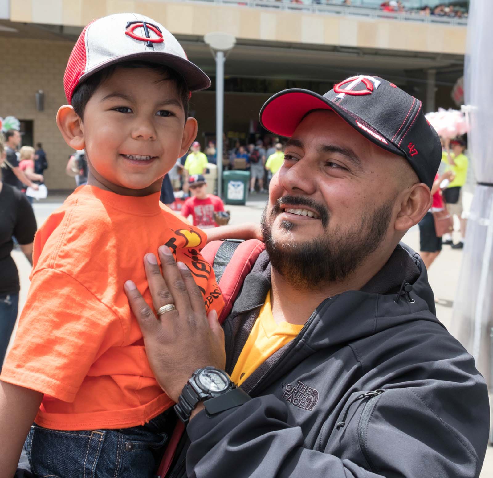Mateo and his father at a baseball game