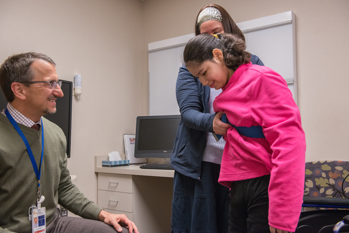 Dr. Novacheck with Gillette patient during a clinic visit.
