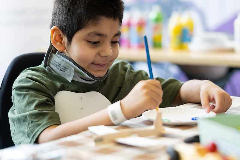 Camp Gillette attendee enjoying craft activities.
