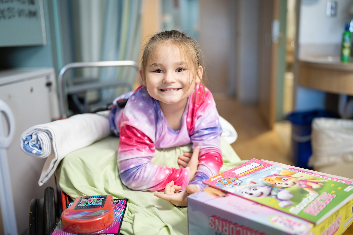 Gillette Children's patient enjoys a visit during the Firefighters Carnival.