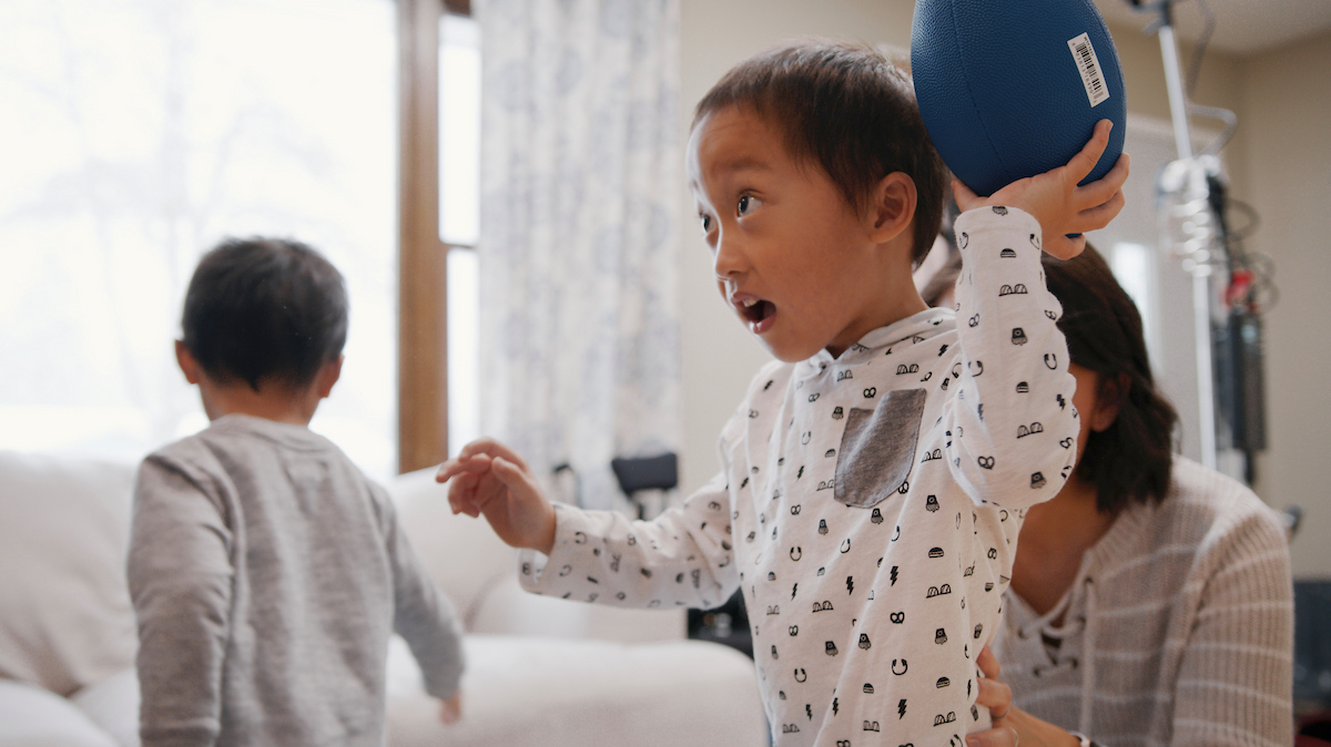 A patient during a virtual visit working with therapy provider at Gillette Children's