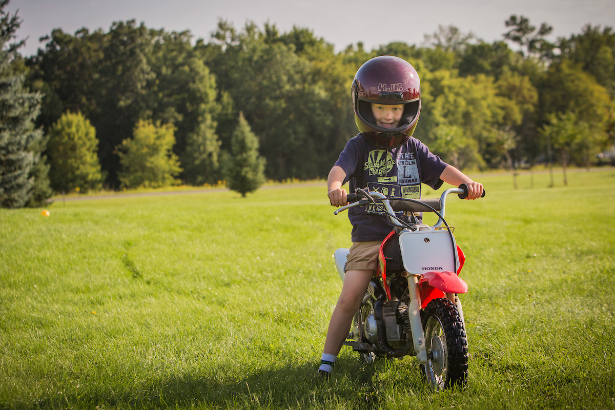 Gillette Children's patient with Hydrocephalus plays on his scooter.