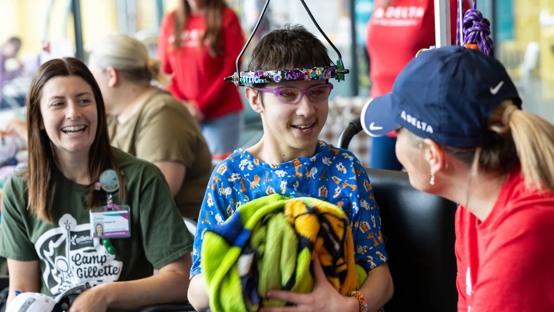 Gillette Children's is a Children’s Miracle Network Hospital. Patient enjoys a visit Delta Airlines flight crew during Camp Gillette.
