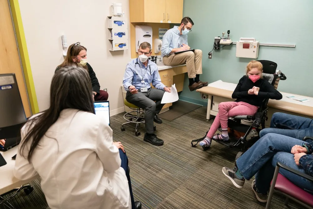 Dr. Beisang and Dr. Feyma meet with patients at Gillette Children's.
