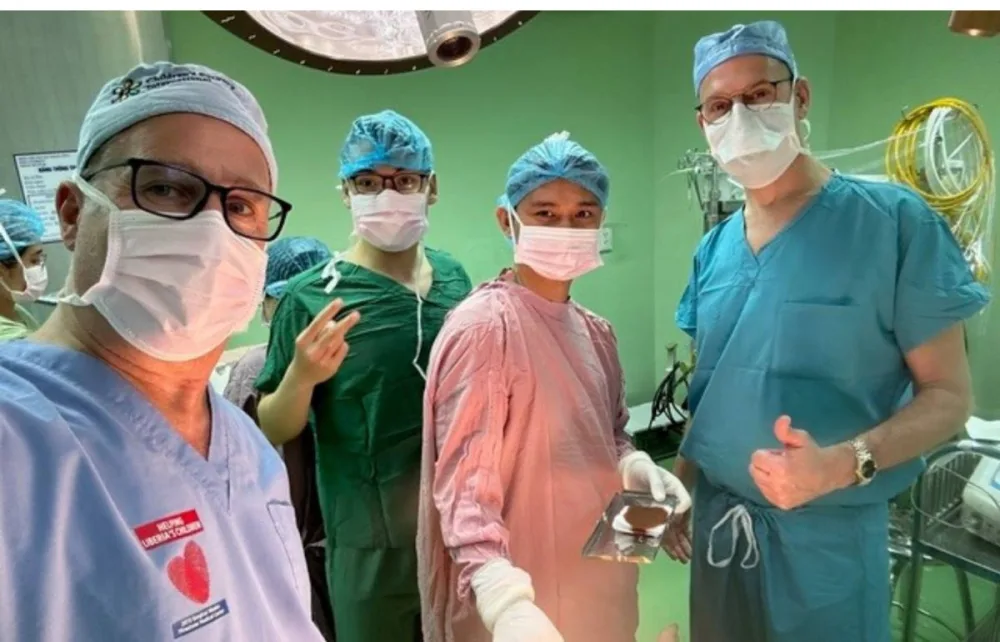 Gillette pediatric urologist, David Vandersteen, posing with other providers in surgical gear at Gillette Children's.