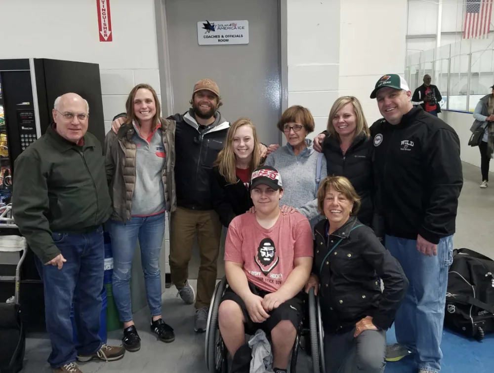 Joe and family at hockey game at Gillette Children's.