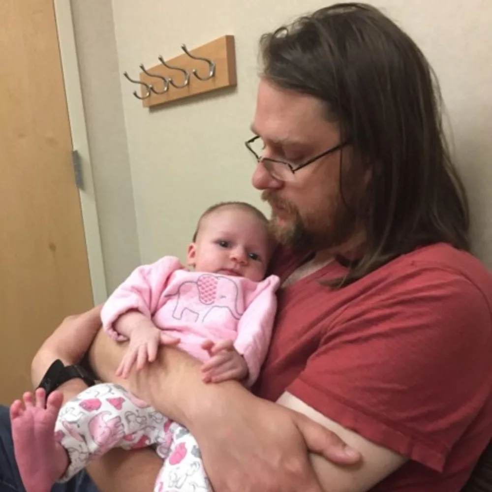 Gillette Children's SMA patient as an infant with father.