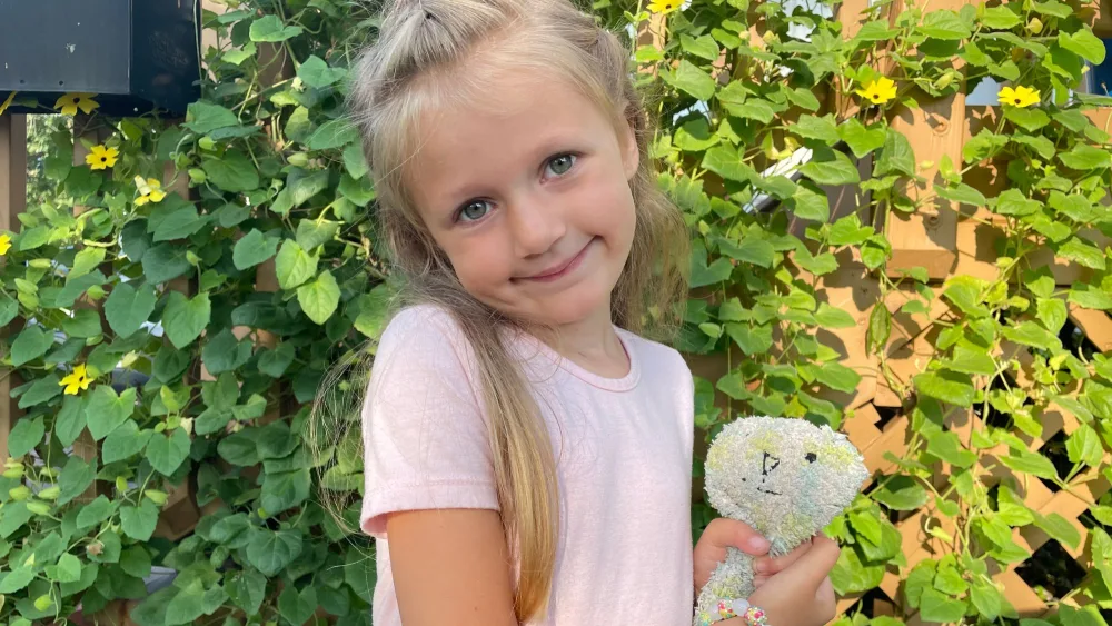 Gillette Children's SMA patient with stuffie toy.