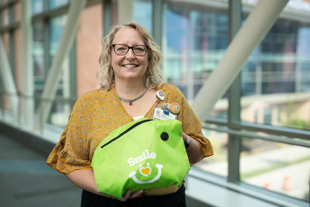 Gillette Children's advanced pediatric nurse practitioners, Martha McGrory, holds a smile bag at Gillette Children's.