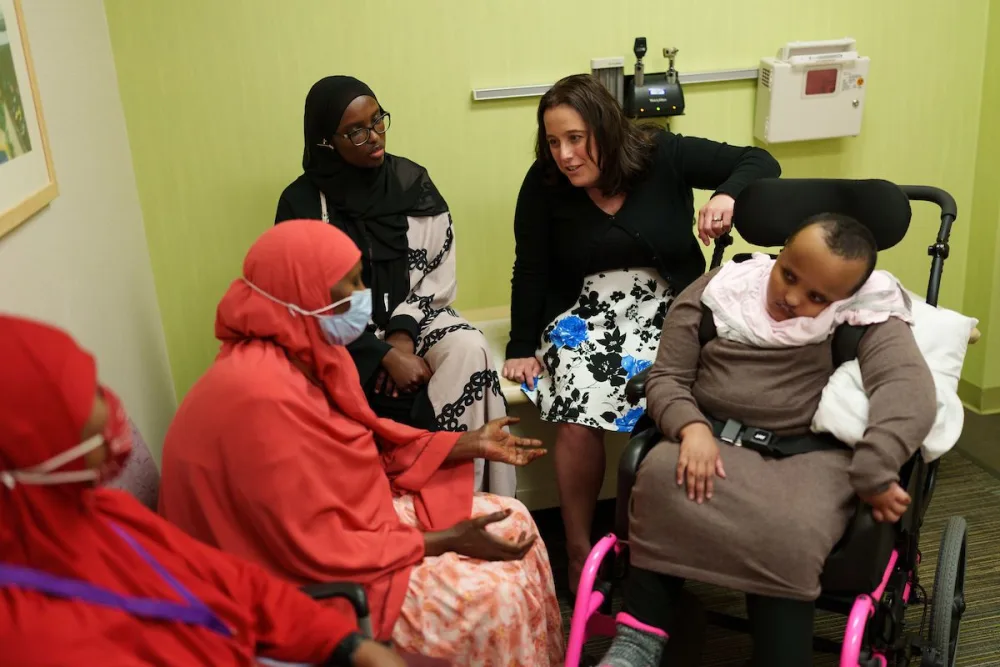 Janelle Pasch-Berglund meets with patients at Gillette Children's.