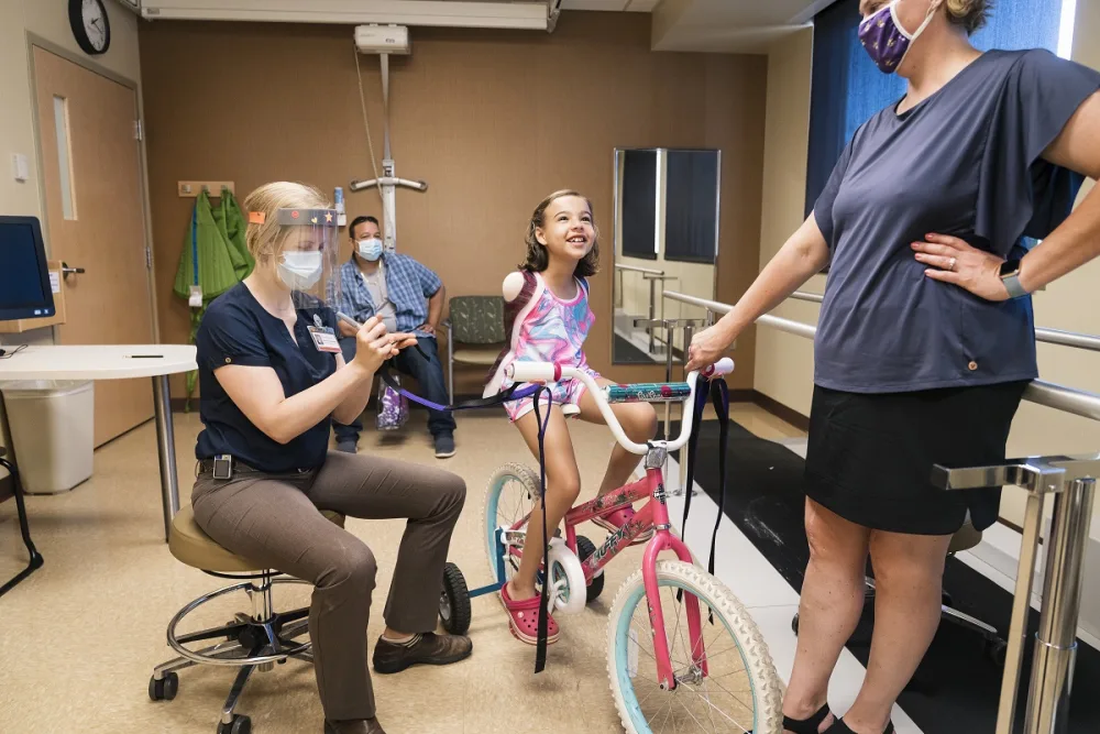 Ruth Evelyn took her first spin on her bike at Gillette Children's.