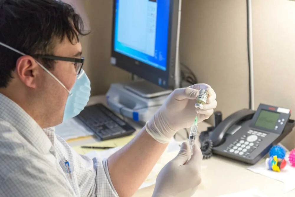 Randal Richarson, MD, prepares an injection of Spinraza at Gillette Children's.