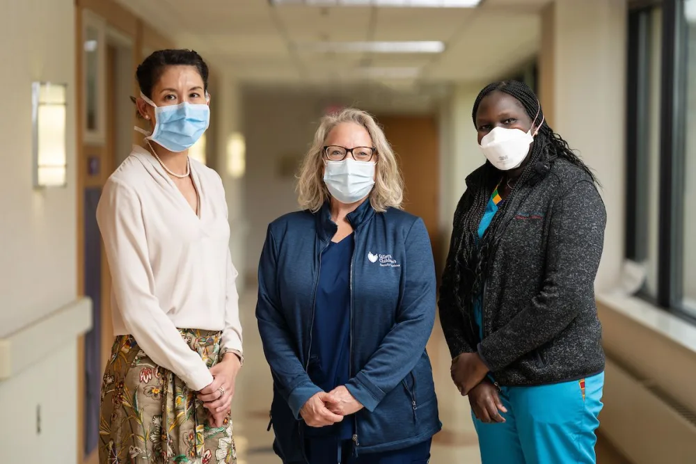 The expert craniofacial team at Gillette Children's smiles for photo.