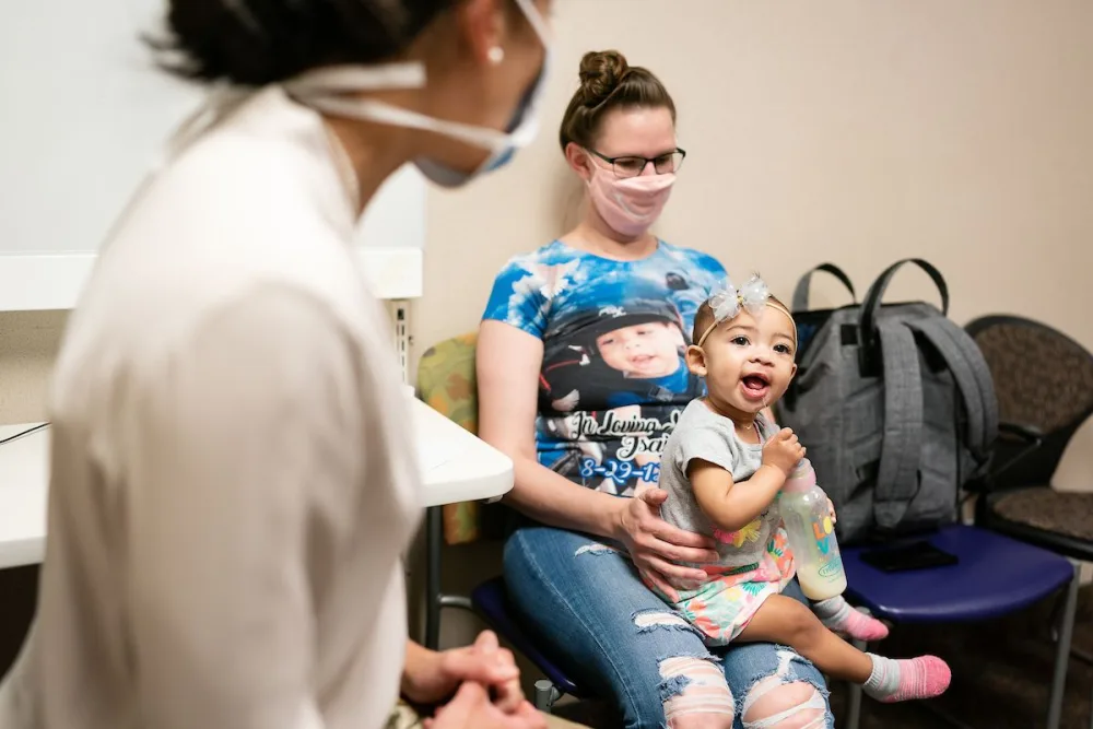 Janessa Erickson and her daughter, Robyn, meet with Dr. Barta at Gillette Childrens.