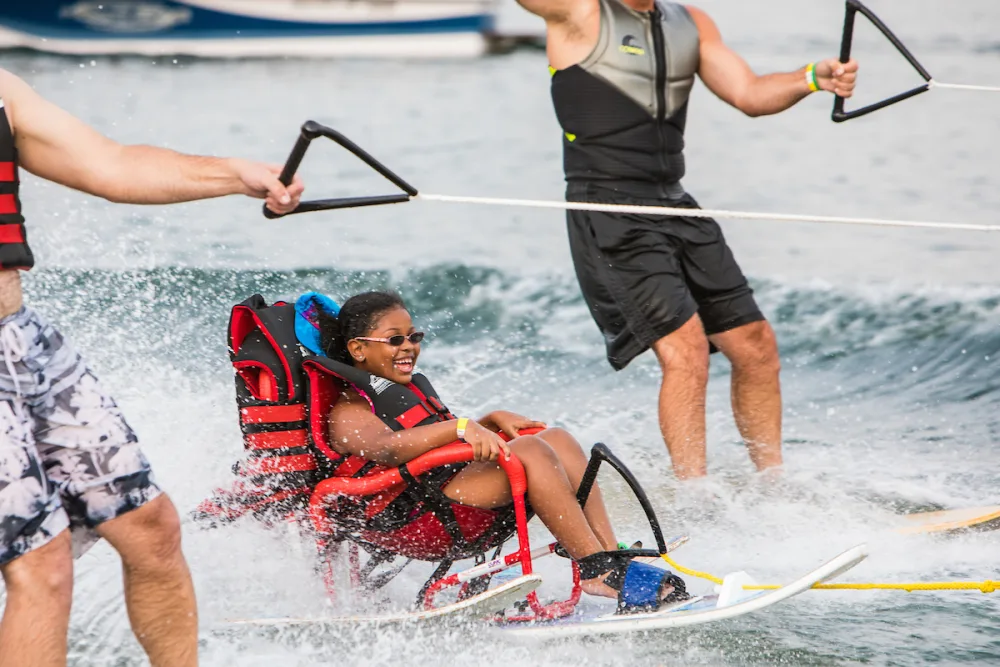 ZaLayaa smiles as she water skis at water ski day with Gillette Children's.