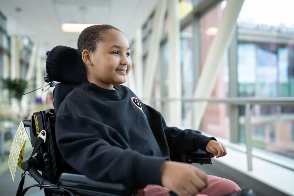 Photo of ZaNii smiling at Gillette Children's.