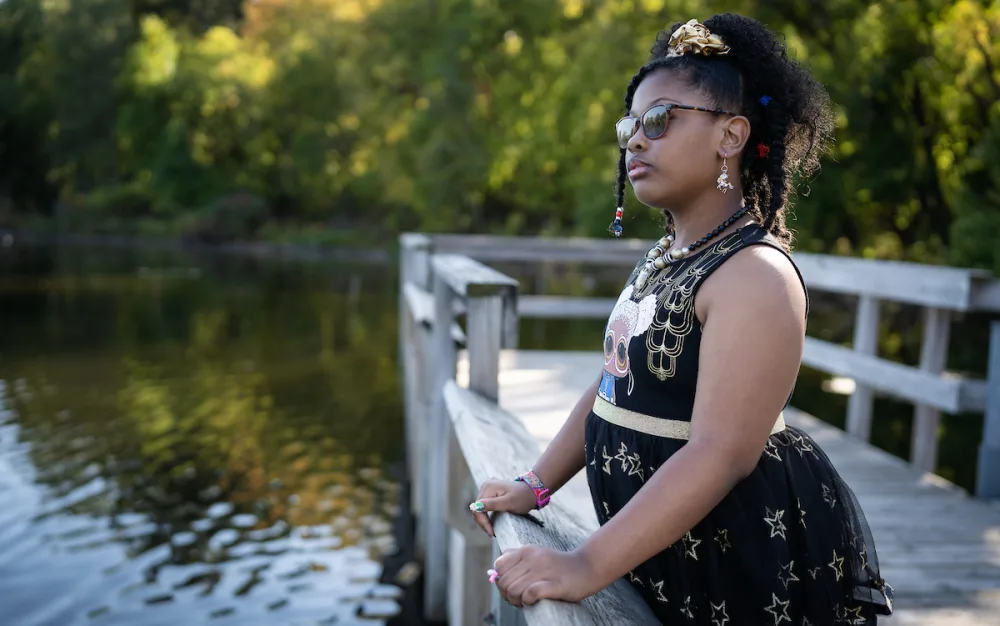 zalayaa overlooks lake at part at Gillette Children's.