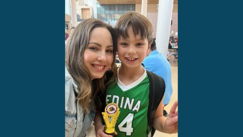 Child and mother with trophy  - Gillette Children's.