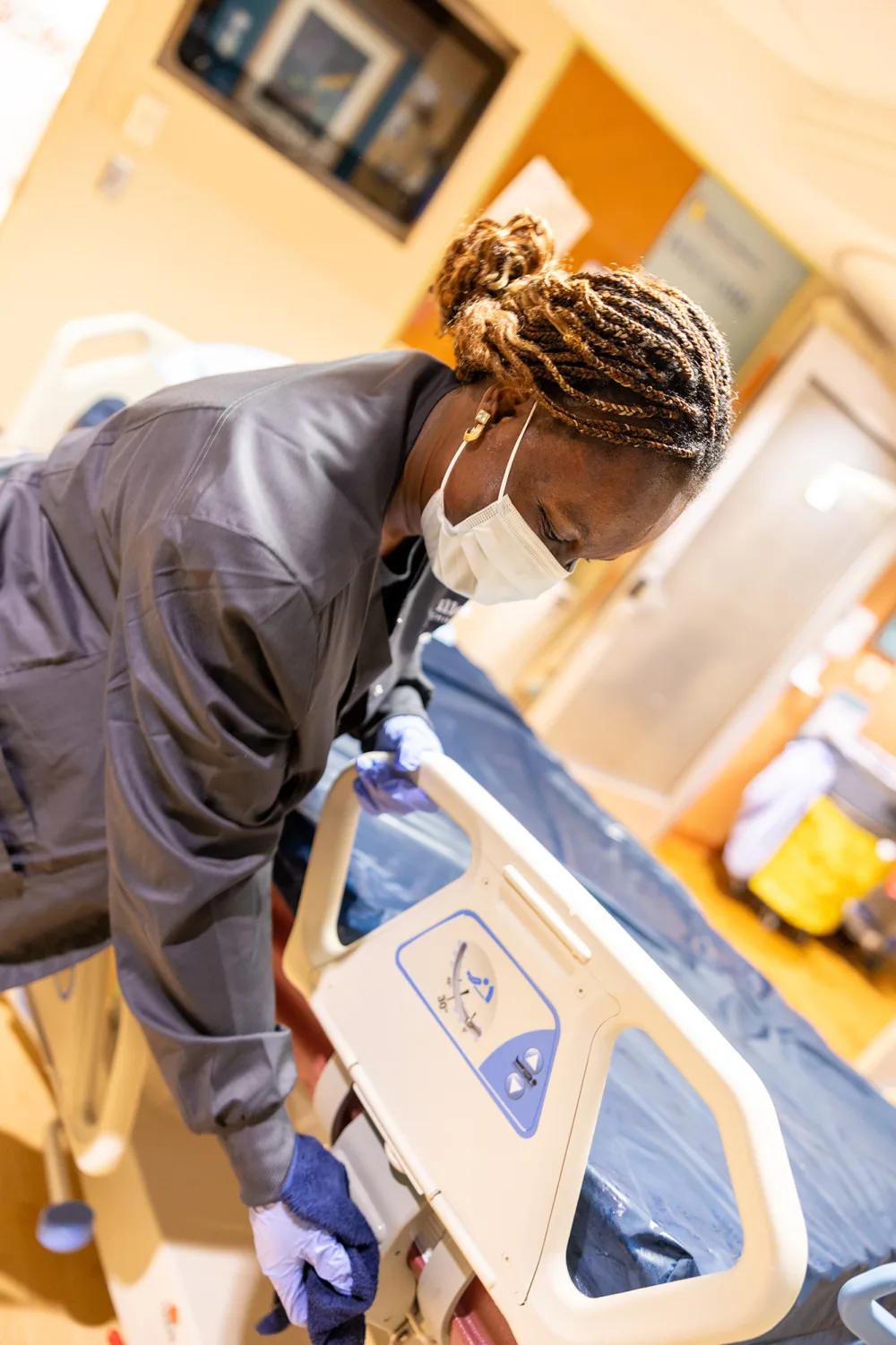 Gillette EOC staff Peggy Massaquoi cleaning a patient room.