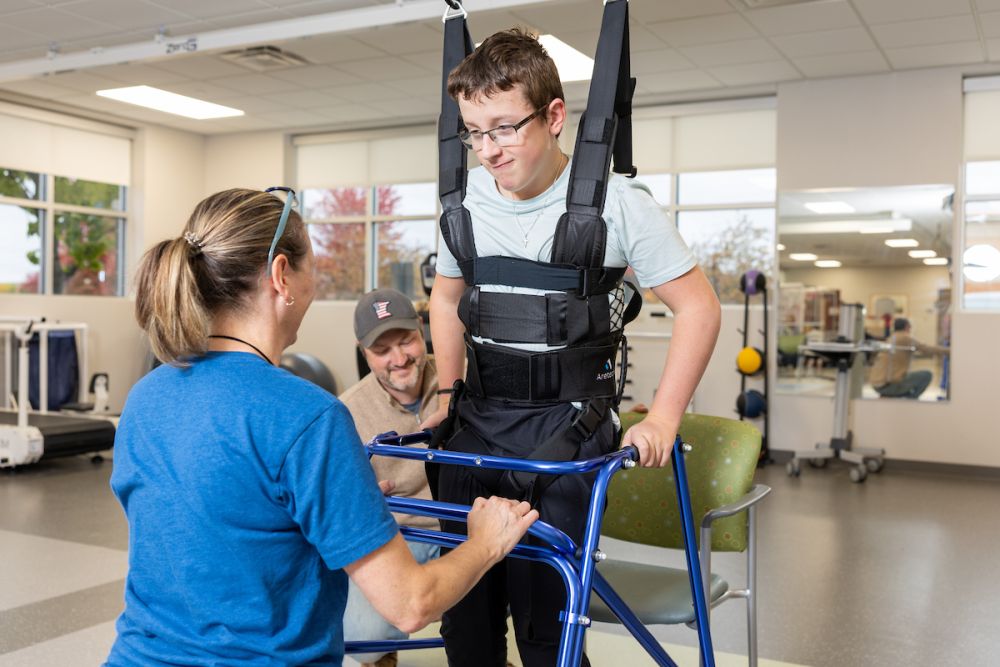 Provider and patient using new equipment at the Maple Grove rehab gym
