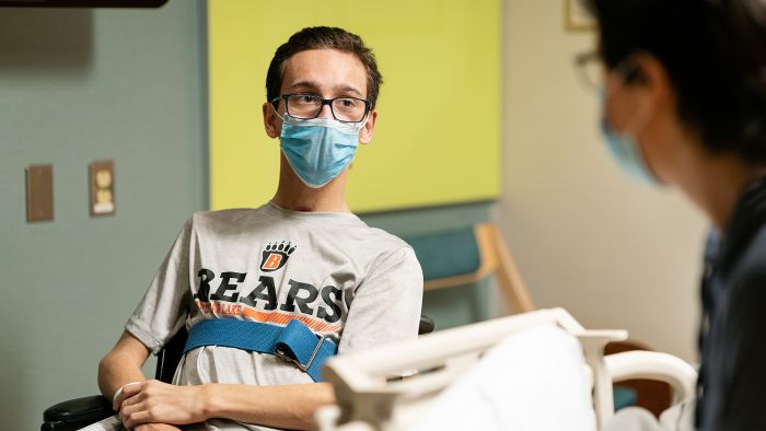 Gillette Children's patient Caleb Binkert meets with a Gillette provider.