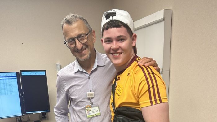 Smiling Dr. Novacheck and Oran, his patient who came all the way from Ireland