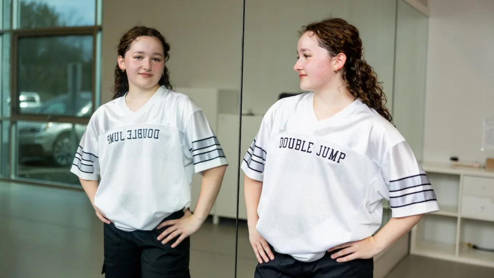 Girl and reflection in the mirror at a dance studio - Gillette Children's