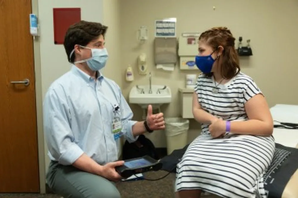 Gillette pediatric orthopedic surgeon, Dan Miller, MD, speaks to Alexis Verzal. Their relationship is built on trust and good communication.