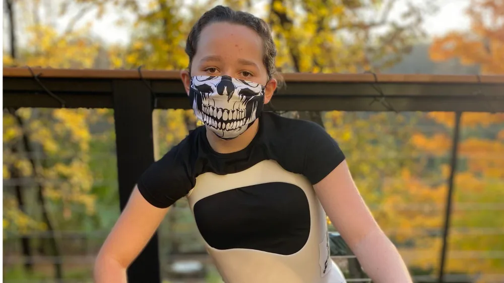 Girl in Halloween costume that uses scoliosis brace - Gillette Children's.