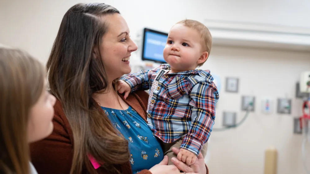 Wyatt Krentz is pictured with his mother Kaitlin and sister Harper in the Clubfoot Clinic