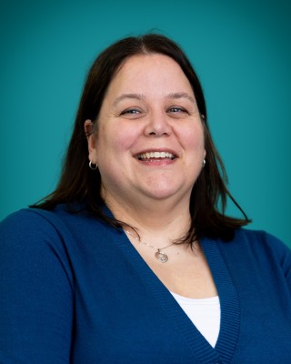 Portrait of Cathleen Rock smiling.