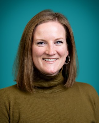 Portrait of Dana Hoehn smiling.