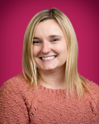 Portrait of Ellie Sullivan smiling.