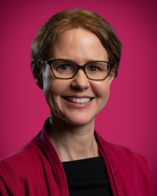Portrait of Kelli Moberg smiling.