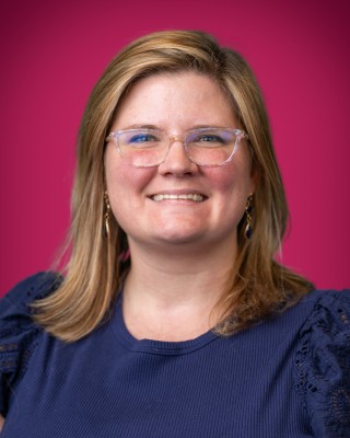 Portrait of Lauren Manston smiling.