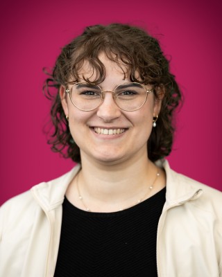 Portrait of Naomi Patrick smiling.