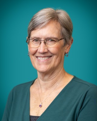 Portrait of Teresa Schultz smiling.