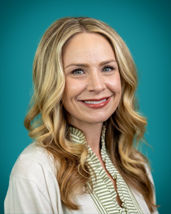 Portrait of Amanda Dominik smiling.