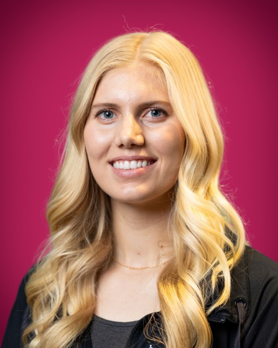 Portrait of Clara Petersen smiling.