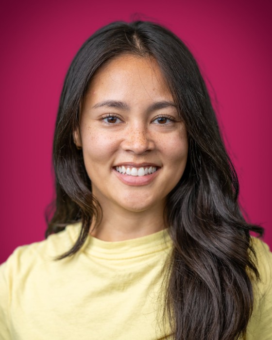 Portrait of Elena Burke smiling.