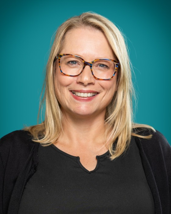 Portrait of Kelly Bolf smiling.