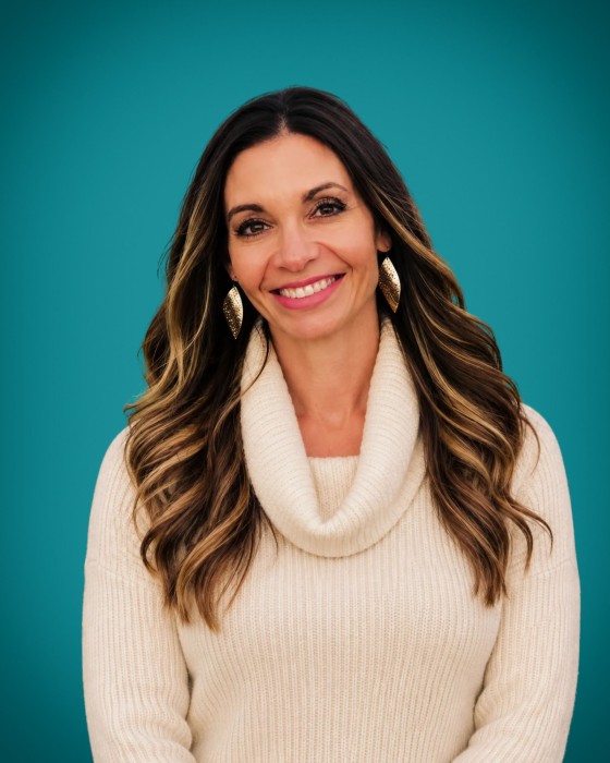 Portrait of Kelly Dziedzic smiling - Gillette Children's
