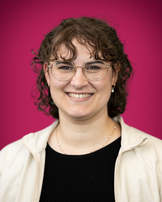 Portrait of Naomi Patrick smiling.