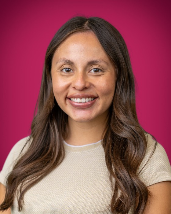 Portrait of Roxana Chirinos smiling.